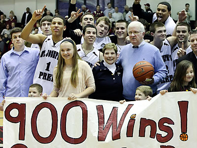St. Joseph&acute;s Prep coach Speedy Morris celebrates his 900th career win with his team and family. (Steven M. Falk/Staff Photographer)