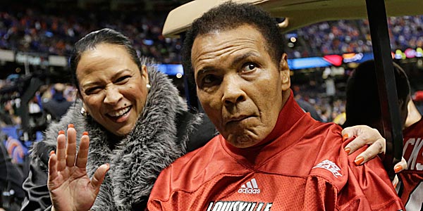 Muhammad Ali&acute;s daughter knocked down rumors of her father being near death Sunday, saying he was at home watching the Super Bowl. (Dave Martin/AP file photo)
