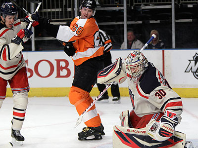 The Flyers are 1-7 against the Rangers and Bruins and have been outscored by a 32-15 margin. (Kathy Willens/AP)