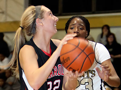 Carroll&acute;s Olivia DeRogatis shoots over Neumann-Goretti&acute;s Tiera Nicholsen. (Stephen M. Falk/Staff Photographer)