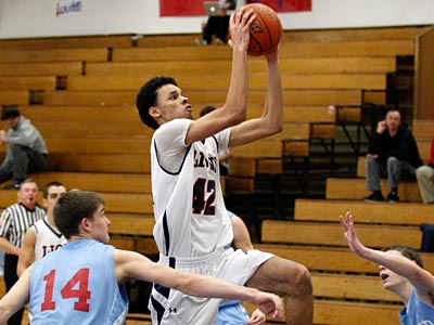 Cardinal O&acute;Hara&acute;s Ed Allen (center) drives toward the basket<br />against Father Judge. (Yong Kim/Staff Photographer)