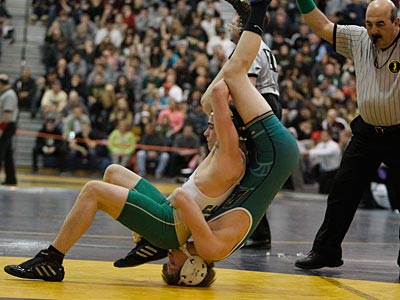 Camden Catholic&acute;s Alex Smith (left) gets a decision on DePaul&acute;s Lou<br />Carusillo in 120-pound match. (Ron Cortes/Staff Photographer)