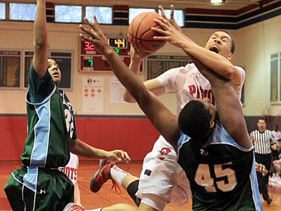 Germantown Academy&acute;s Greg Dotson is met by two Shipley defenders on his way to the basket. (Michael Bryant/Staff Photographer)