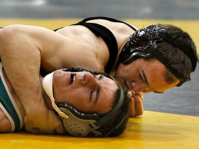 Camden Catholic&acute;s T.J. Miller pins DePaul&acute;s Brad Trump in a 145-pound championship match. (Ron Cortes/Staff Photographer)