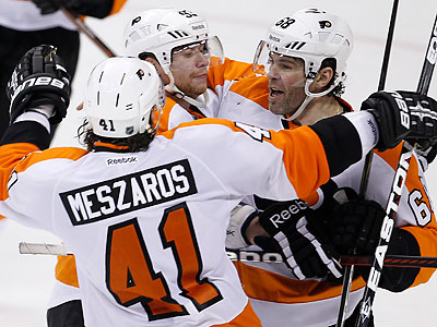 Jaromir Jagr (right) scored the game-winning goal with 44 seconds left in overtime. (Trevor Hagan/Canadian Press/AP)