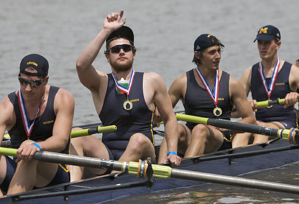 Michigan rowers celebrate after receiving their medals and the Richard O&acute;Brien Trophy for winning the Men&acute;s Varsity Heavyweight Eight at the Dad Vail Regatta on Saturday.  (John Costello / Staff Photographer) 