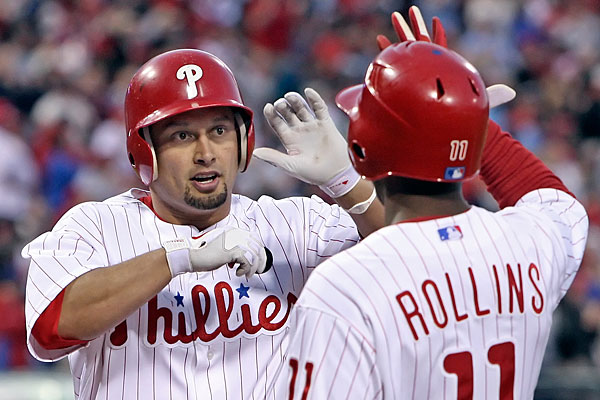 Shane Victorino is greeted by Jimmy Rollins after hitting a home run. (Steven M. Falk/Staff Photographer)