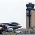 Philadelphia International Airport/A US Airways plane lands in front of the control tower Monday afternoon 3/13/00. DN Steven M. Falk