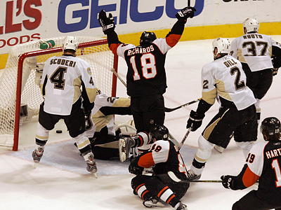 Mike Richards, Daniel Brière and Scott Hartnell were all in front of the net when Brière scored the Flyers&acute; second goal of the game. (Barbara L. Johnston/Inquirer)