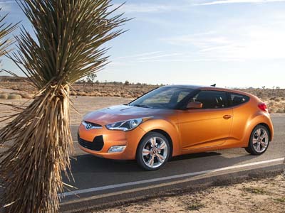 The 2012 Hyundai Veloster offers a lot of fun in a small package. A very small package, if you happen to be in the back seat. 