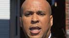 FILE - In this April 13, 2012 file photo, Newark, N.J. Mayor Cory Booker speaks in Newark. Booker, an Obama ally, is the latest politician in damage-control mode in a presidential race already noteworthy for the informal spokespeople who veer wildly off message. His criticism of �nauseating� ads like the Obama campaign attack on Mitt Romney&acute;s business record illustrates the difficulty of controlling the message.  (AP Photo/Mel Evans, File)