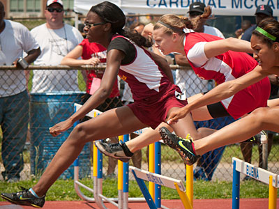 Glassboro&acute;s Asia Pendleton, left, wins the 100-meter high hurdles race at the South Jersey sectional track champs. (Ron Tarver/Staff Photographer)