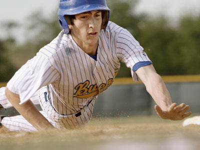 Matt Luisi of Buena slides back into first to avoid a pick-off attempt. (Elizabeth Robertson/ Staff Photographer )