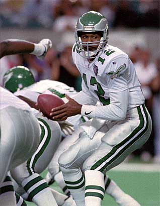 Philadelphia Eagles former quarterback Randall Cunningham holds his young  son, Christian as he is inducted into the Eagles Honor Roll during half  time ceremonies in Philadelphia at Lincoln Financial Field September 27