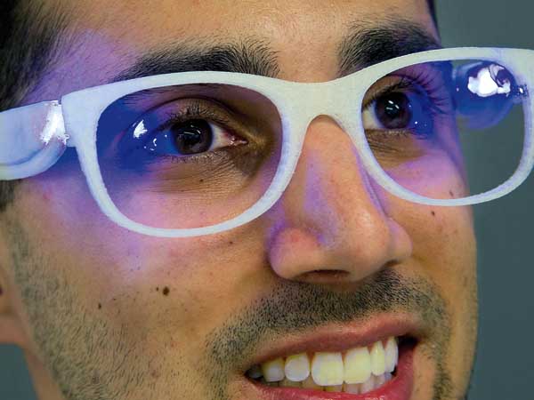 Troy Hudson, 22, a senior at Drexel University, models his Lumiware therapy glasses for people with seasonal affect disorder. Hudson´s hometown is Runnemede, NJ.  Photo taken May 27, 2014 at Drexel´s URBN Center.  ( CLEM MURRAY / Staff Photographer )