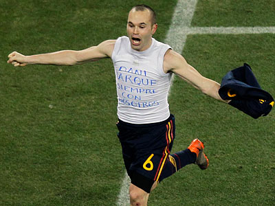 Spain&acute;s Andres Iniesta celebrates scoring the winning goal in the World Cup final. (Hassan Ammar/AP)
