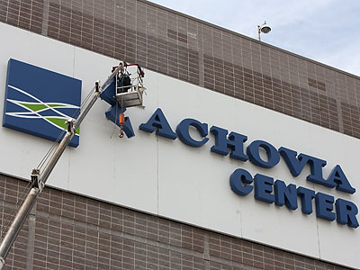 Workers began removing the Wachovia Center logo yesterday. (Ed Hille/Staff Photographer)
