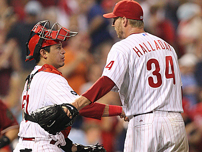 Carlos Ruiz congratulates Roy Halladay, who pitched a complete game for the win. (David M Warren/Staff Photographer)<br />