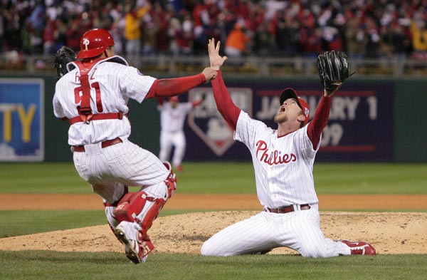 Brad Lidge and Carlos Ruiz celebrate winning it all after the end of the ninth inning.