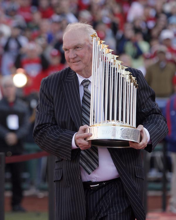 Phillies Manager Charlie Manuel carries the 2008 World Series trophy during the championship celebration at Citizens Bank Park on Friday, October 31, 2008.  ( Yong Kim / Staff Photographer )