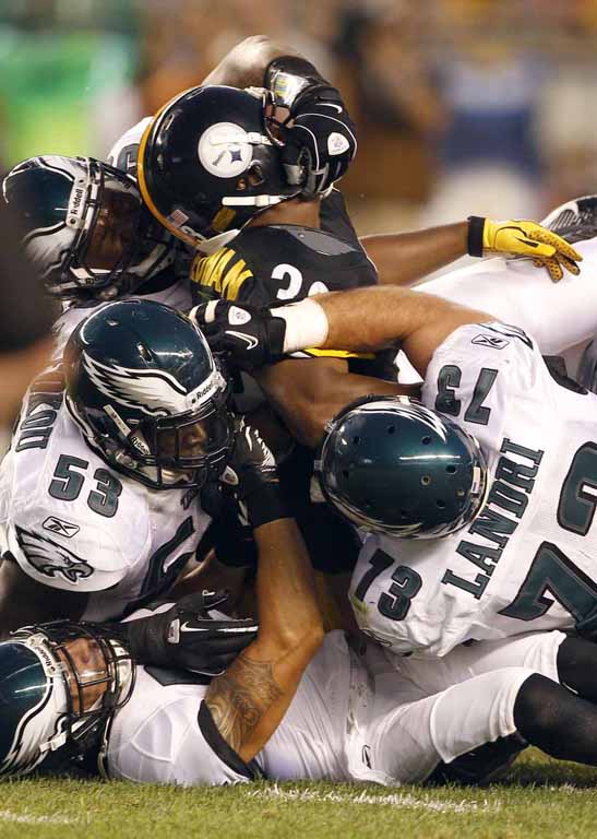 Philadelphia Eagles quarterback Michael Vick (7) looks to throw against the Pittsburgh  Steelers during the first quarter of an NFL pre-season football game  Thursday, Aug. 18, 2011 at Heinz Field in Pittsburgh.(AP