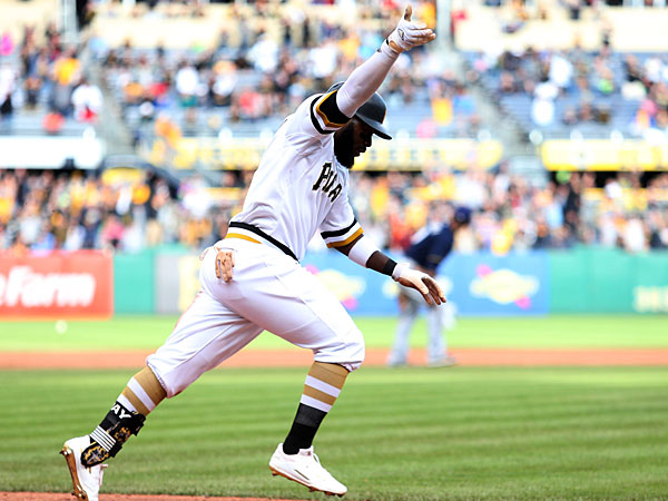 Pittsburgh Pirates left fielder Josh Harrison (5) reacts running to first base after hitting a game winning RBI single against the Milwaukee Brewers during the eleventh inning at PNC Park. The Pirates won 7-6 in eleven innings. 