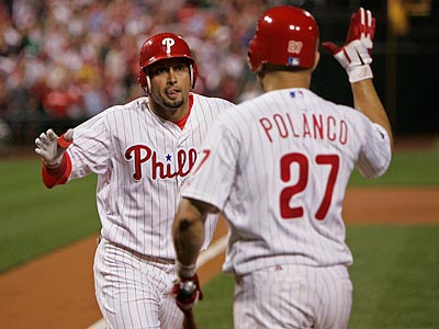Shane Victorino is congratulated by Placido Polanco after giving the Phillies an early lead with a leadoff home run. (Michael Bryant/Staff Photographer)