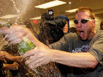 Roy Halladay celebrates after his 2-hit shutout clinched the Phillies´ fourth straight NL East title. (Yong Kim/Staff Photographer)