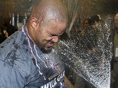CC Sabathia gets a champagne shower after his complete game four-hitter led the Brewers to their first playoff berth since 1982. (Morry Gash/AP)