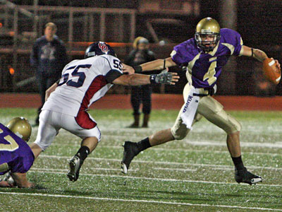 Roman Catholic quarterback Joseph Fuoco (right) is chased by Cardinal O&acute;Hara&acute;s Chris Nolan in last week&acute;s 21-14 loss. Fuoco will try to rebound against Father Judge tomorrow. (Kevin Cook / Staff Photographer)