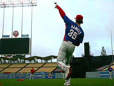 Cole Hamels throws some long toss during practice at Dodgers Stadium.