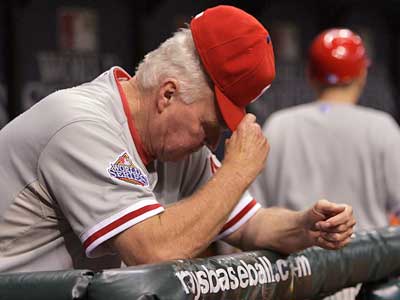 Charlie Manuel watches from the dugout as the Phillies lose to the Rays in Game 2 of the World Series. (Yong Kim / Staff Photographer)