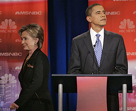 Hillary Clinton (left) walks behind Barack Obama during a break in Tuesday night�s Democratic presidential debate at Drexel University.