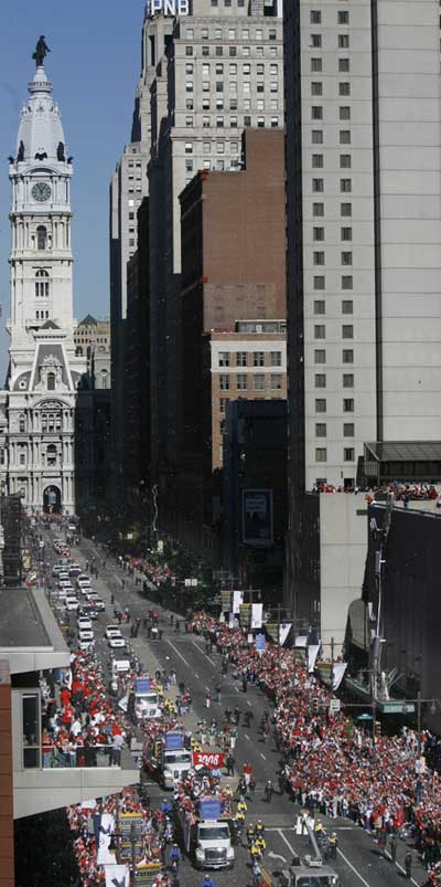 The parade in front of City Hall, from Symphony House. (Charles Fox / Staff Photographer)