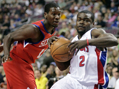 Detroit Pistons guard Will Bynum, right, goes to the basket past 76ers guard Royal Ivey in the first half of the Sixers&acute; 88-81 loss today. (AP Photo/Duane Burleson)