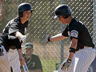 Bishop Eustace&acute;s Greg Brodzinski, left, congratulates Dan Sieracki after Sieracki homered in a 2007 game. Brodzinski may have to choose between college and pro baseball in June. (Jerry Lodriguss / Inquirer)