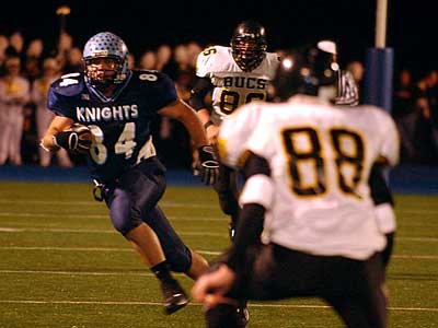 North Penn&acute;s Jeff Ball gains yardage as Interboro&acute;s Dominic Zappone (88) defends on the play during second quarter action. (Barbara L. Johnston/Staff Photographer)