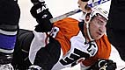 Philadelphia Flyers center Mike Richards, below, dives for the puck as Los Angeles Kings center Jarret Stoll takes it during the first period of an NHL hockey game Wednesday, Nov. 18, 2009, in Los Angeles. (AP Photo/Mark J. Terrill)