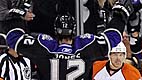 Los Angeles Kings center Jarret Stoll, right, celebrates his goal along with teammate Randy Jones as Philadelphia Flyers center Darroll Powe, center, looks on during the first period of an NHL hockey game, Wednesday, Nov. 18, 2009, in Los Angeles. (AP Photo/Mark J. Terrill)