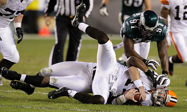 Ken Dorsey is sacked by Trent Cole in the second quarter.  (Ron Cortes/Staff Photographer)