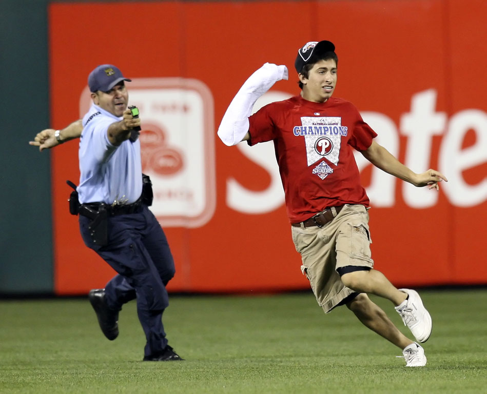 Woman covers face with lipstick at Phillies game