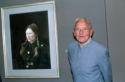 In this 1987 file photo, American artist Andrew Wyeth stands beside one of his paintings of 