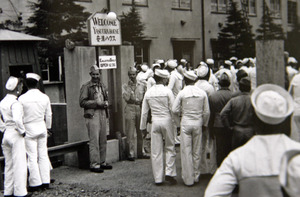 U.S. sailors gather in front of a "comfort station" in Yokosuka. Japan's practice of enslaving women to provide sex for its troops has a little-known sequel.