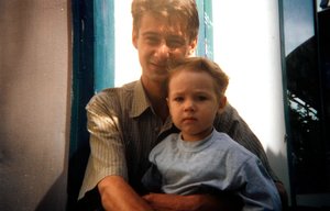 Robert Daniels, shown with his son in Russia, has the new strain of TB and is held in the prison wing of a Phoenix hospital. This illustrates the sometimes extreme steps taken to stop the disease's spread.