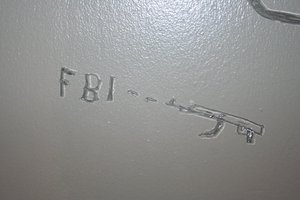 Some of the graffiti that prosecutors say Fort Dix Six suspect Agron Abdullahu scratched into his detention-center cell door.