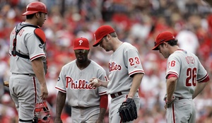 It's the end of the line for Adam Eaton, who waits to be yanked with Rod Barajas (left), Jimmy Rollins and Chase Utley (26).