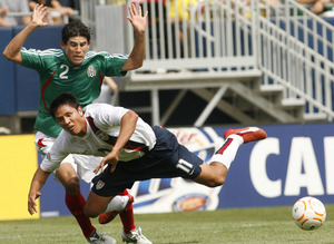 Brian Chang dives in front of Mexico's Jose Jonny Magallon.