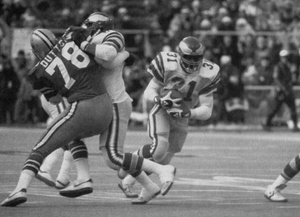 As the Cowboys' John Dutton is blocked, Wilbert Montgomery hits the hole at the start of his 42-yard touchdown run.