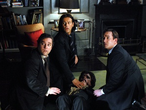 Mourners (from left) Andy Nyman, Rupert Graves and Matthew MacFayden ambush Peter Dinklage before he can tell his damaging secret in director Frank Oz's Ealing-style comedy "Death at a Funeral."