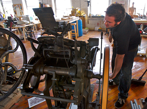 Ryan Howell, at his 100-year-old press at Mad Maude in Kensington, sees letterpress as a rebellion against electronic printing.